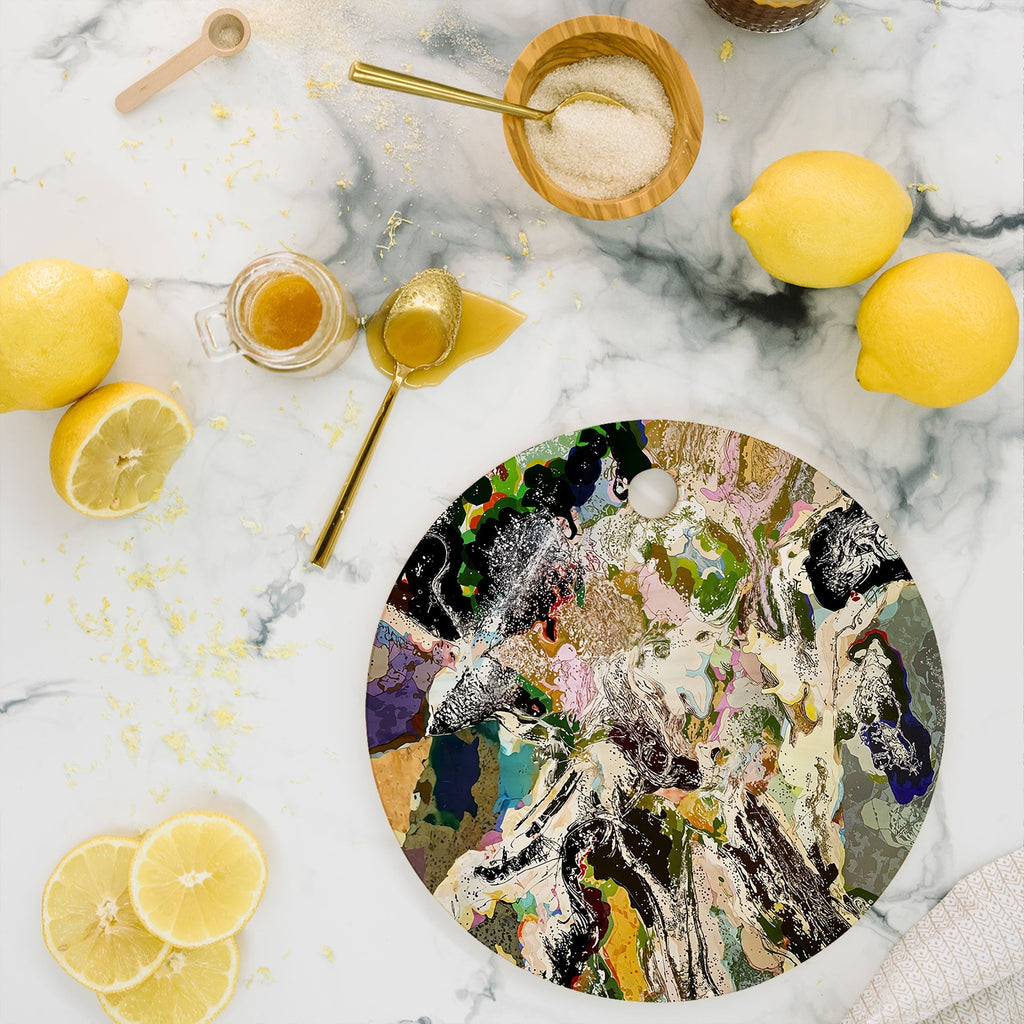 83 Oranges Echoes Beneath the Surface Cutting Board Round