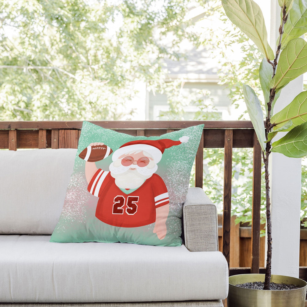 Design by Spark Sporty Football Santa Outdoor Throw Pillow