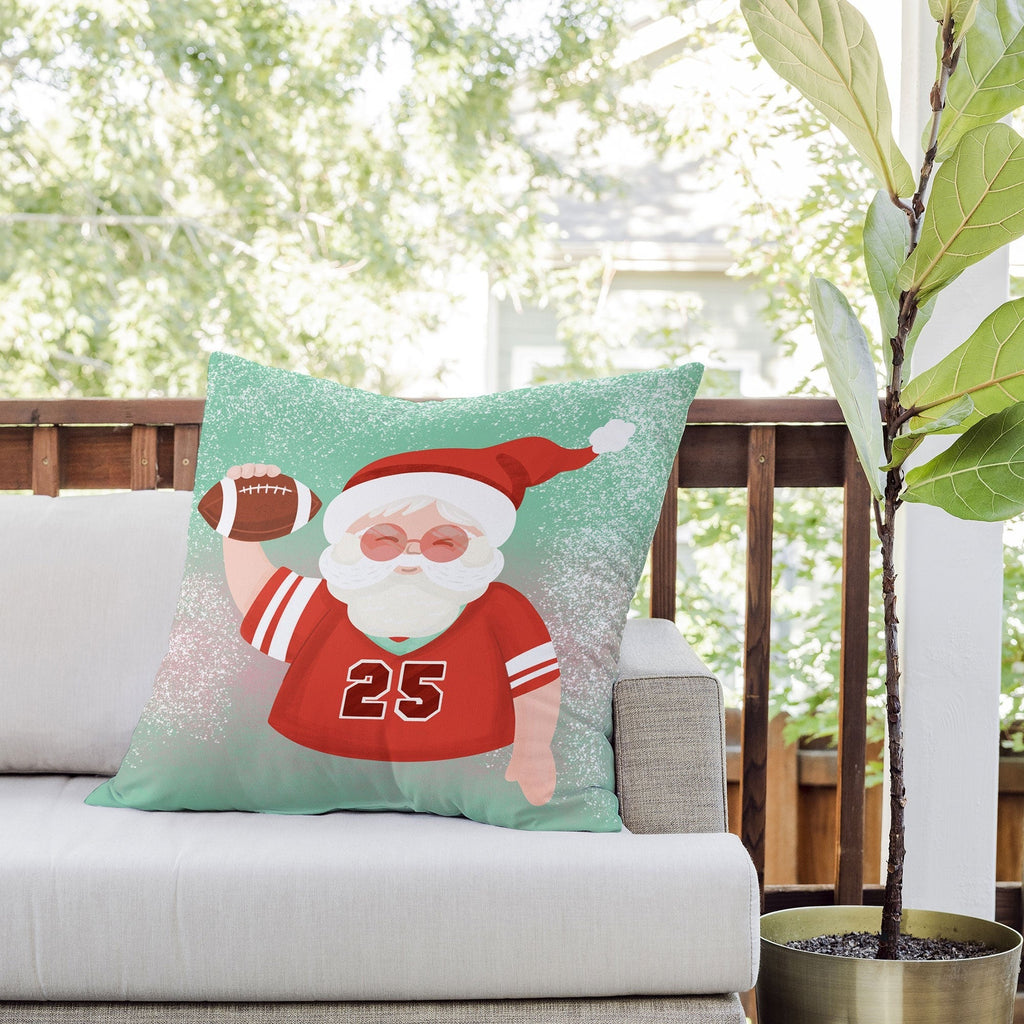 Design by Spark Sporty Football Santa Outdoor Throw Pillow