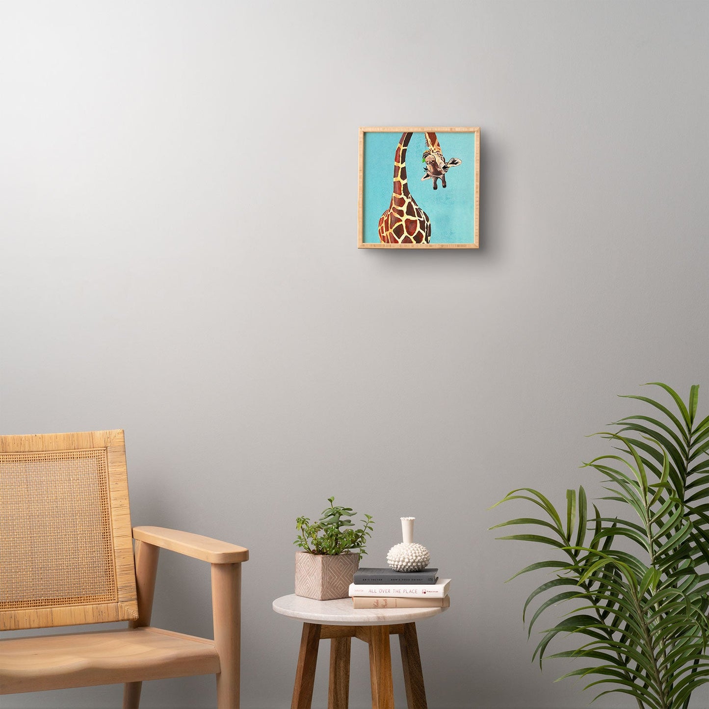 Coco de Paris Giraffe with green leaf Framed Wall Art