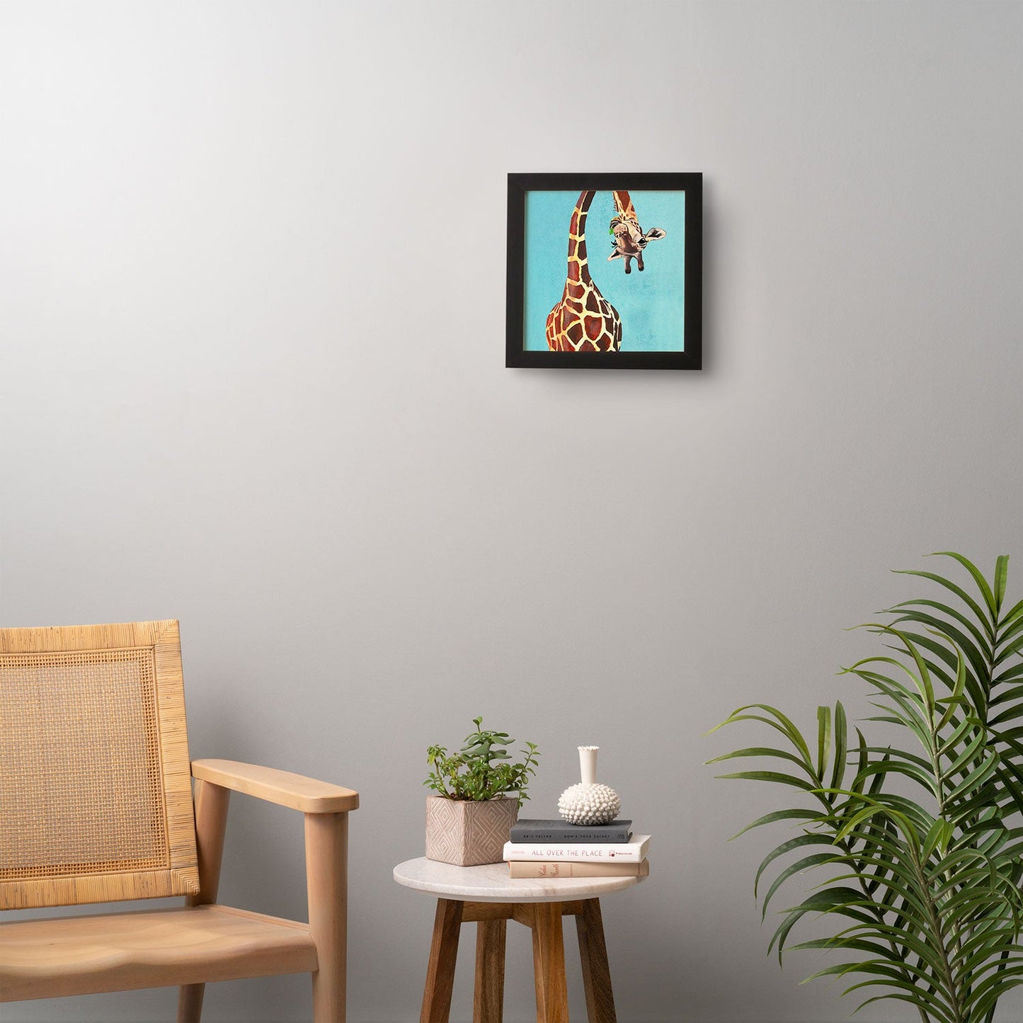 Coco de Paris Giraffe with green leaf Framed Wall Art