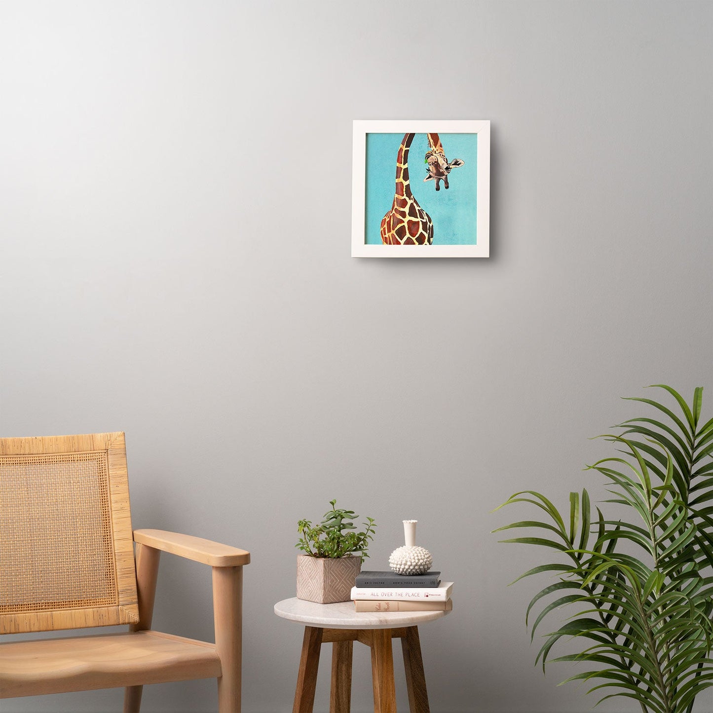 Coco de Paris Giraffe with green leaf Framed Wall Art