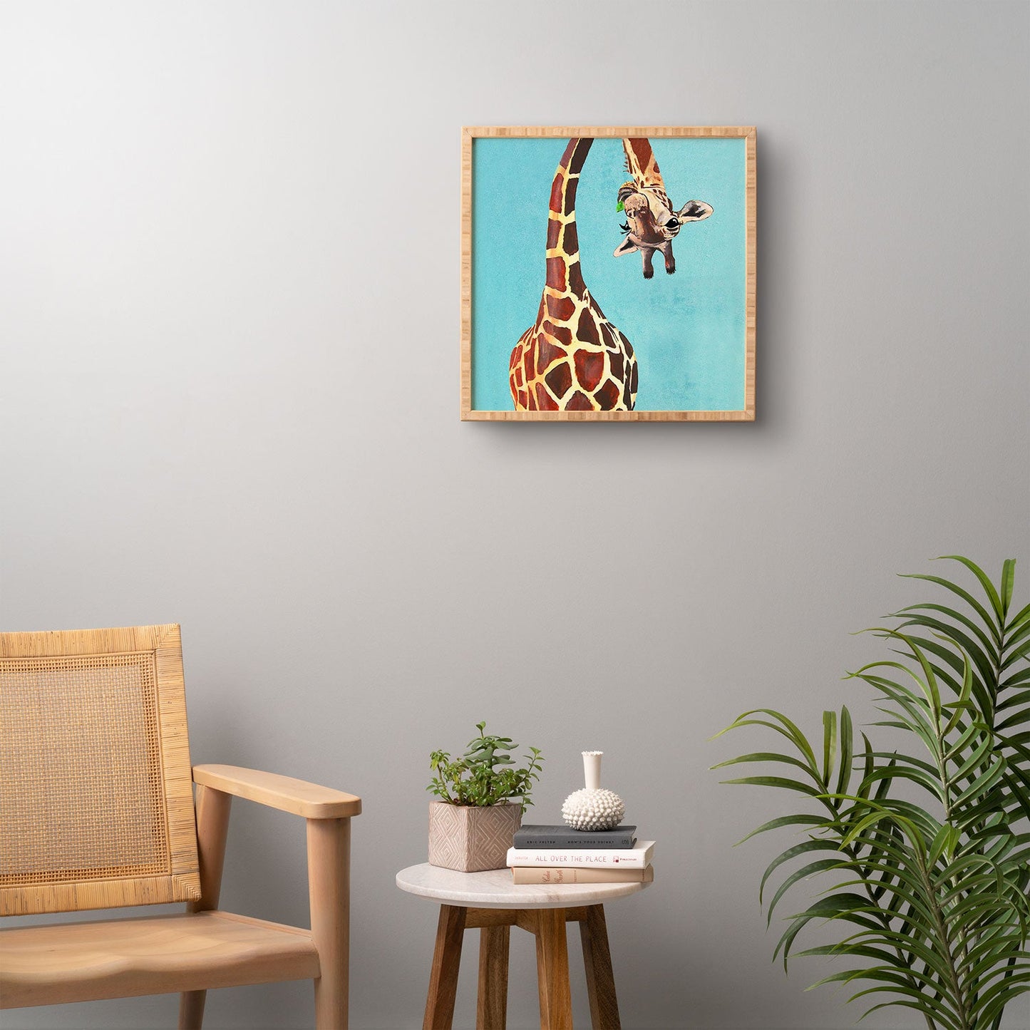 Coco de Paris Giraffe with green leaf Framed Wall Art