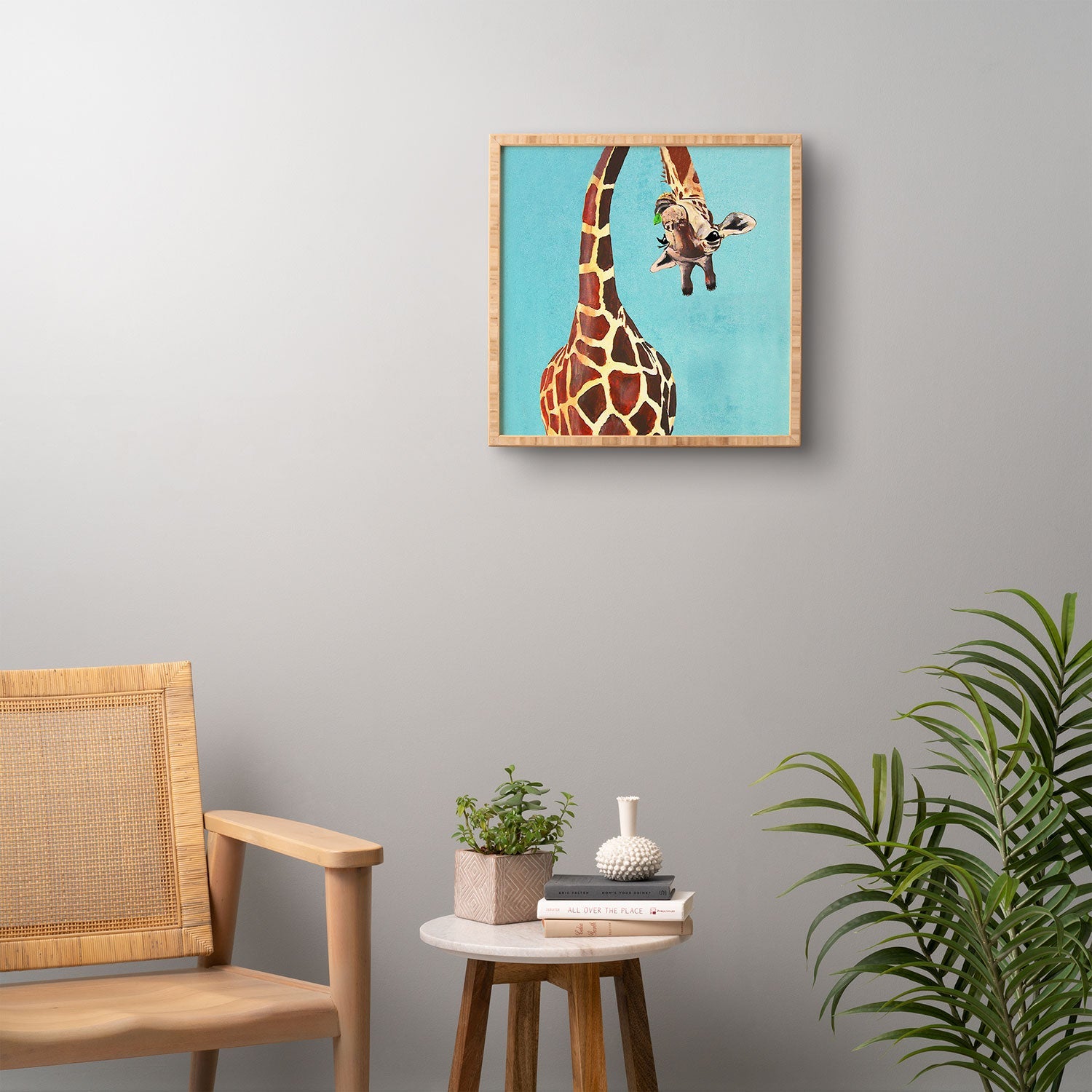 Coco de Paris Giraffe with green leaf Framed Wall Art