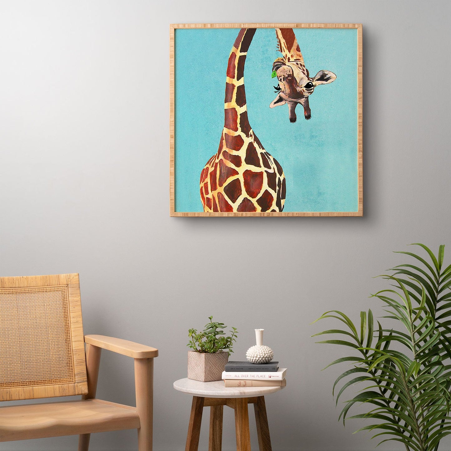 Coco de Paris Giraffe with green leaf Framed Wall Art