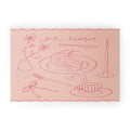 DENY Designs girl breakfast Welcome Mat