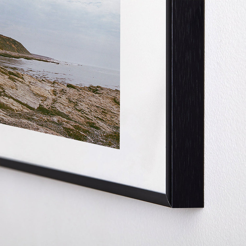 DENY Designs rocky beachside Metal Framed Art Print