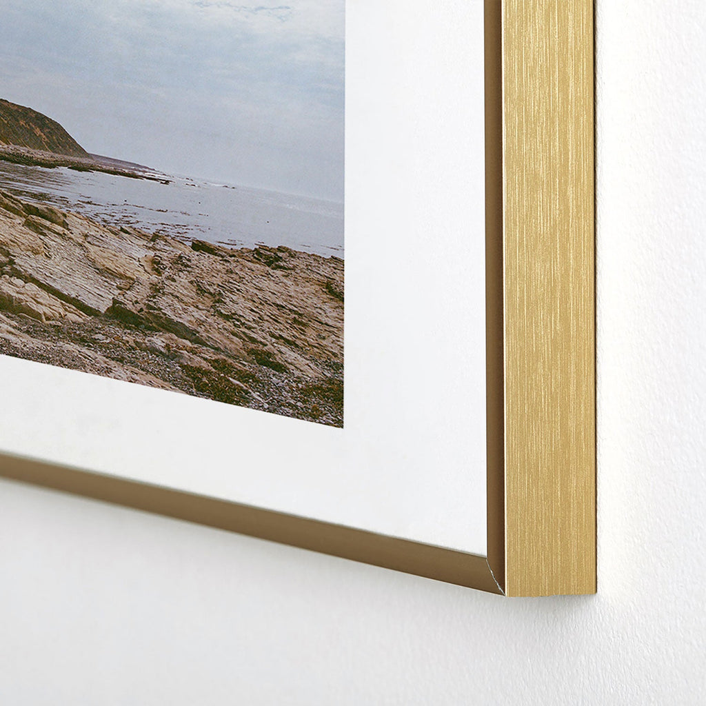 DENY Designs rocky beachside Metal Framed Art Print