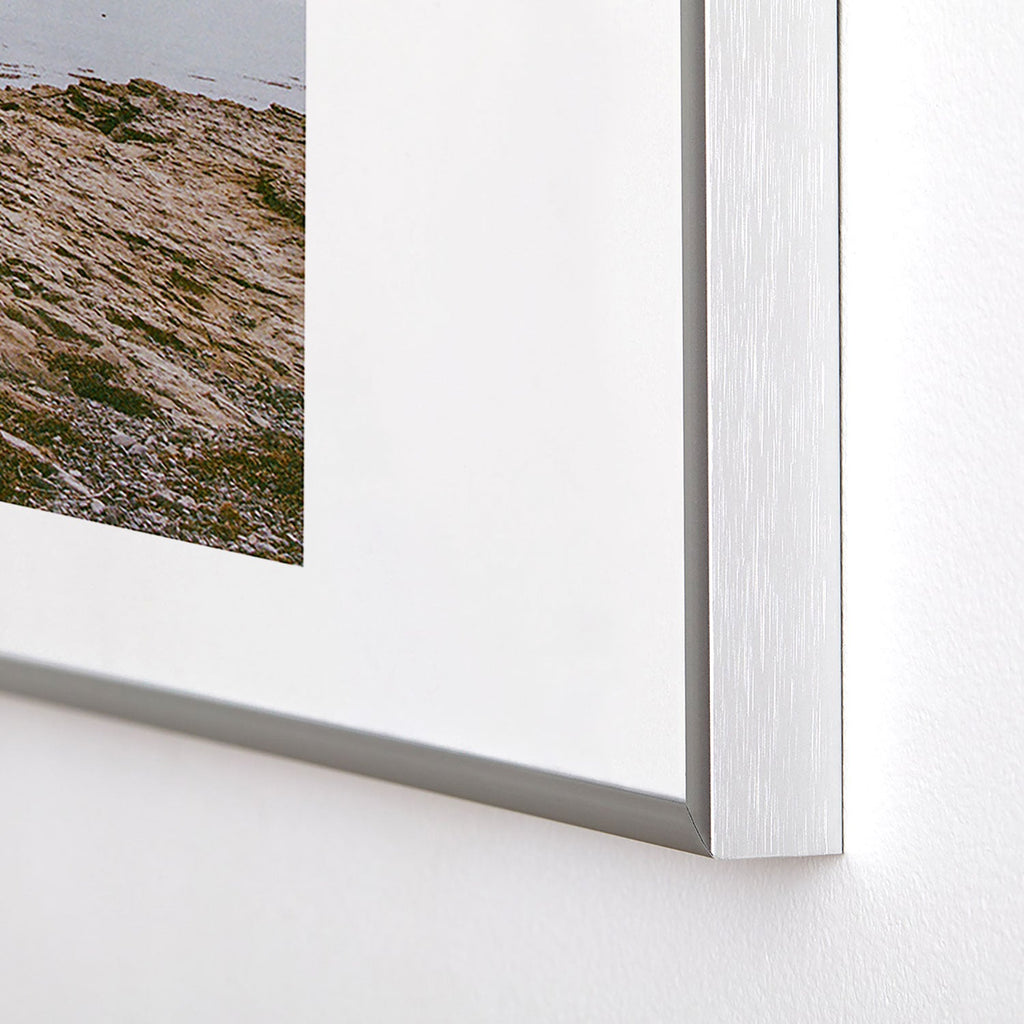DENY Designs rocky beachside Metal Framed Art Print