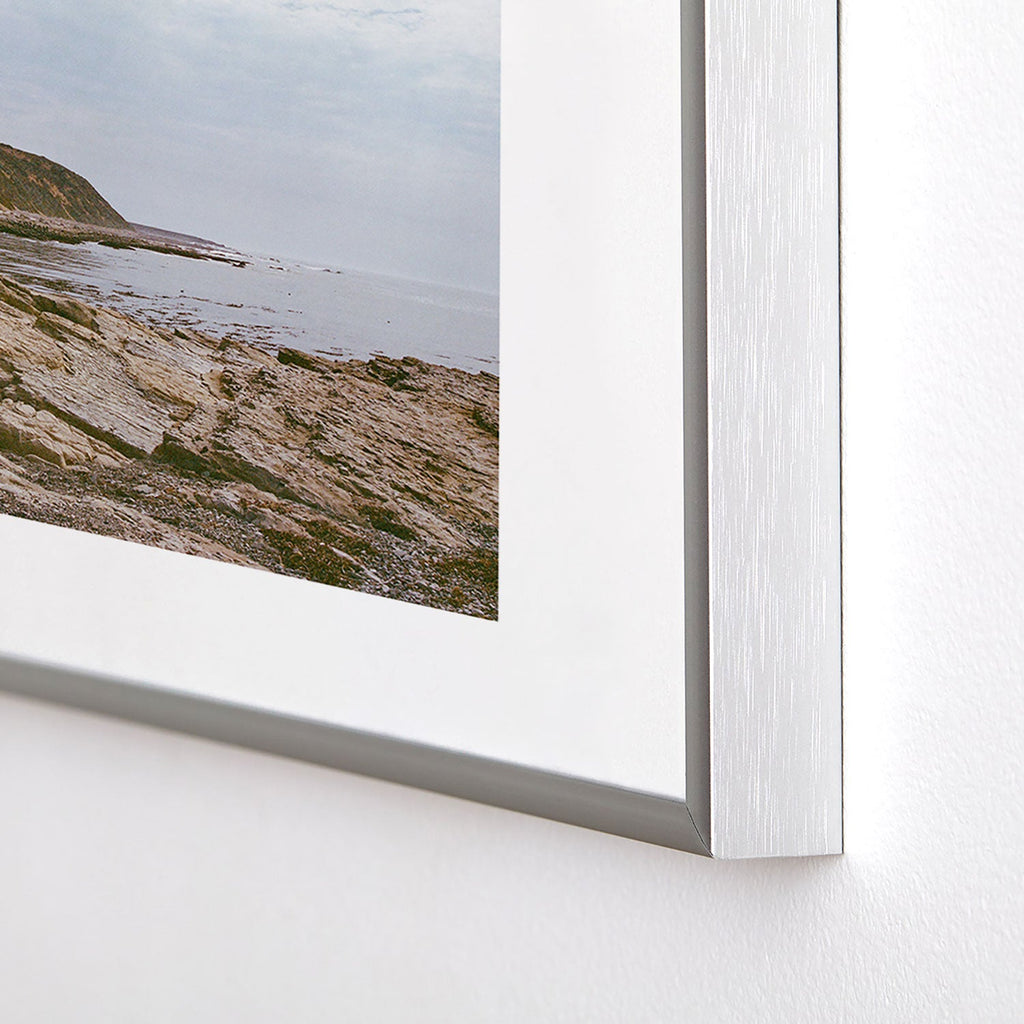 DENY Designs rocky beachside Metal Framed Art Print