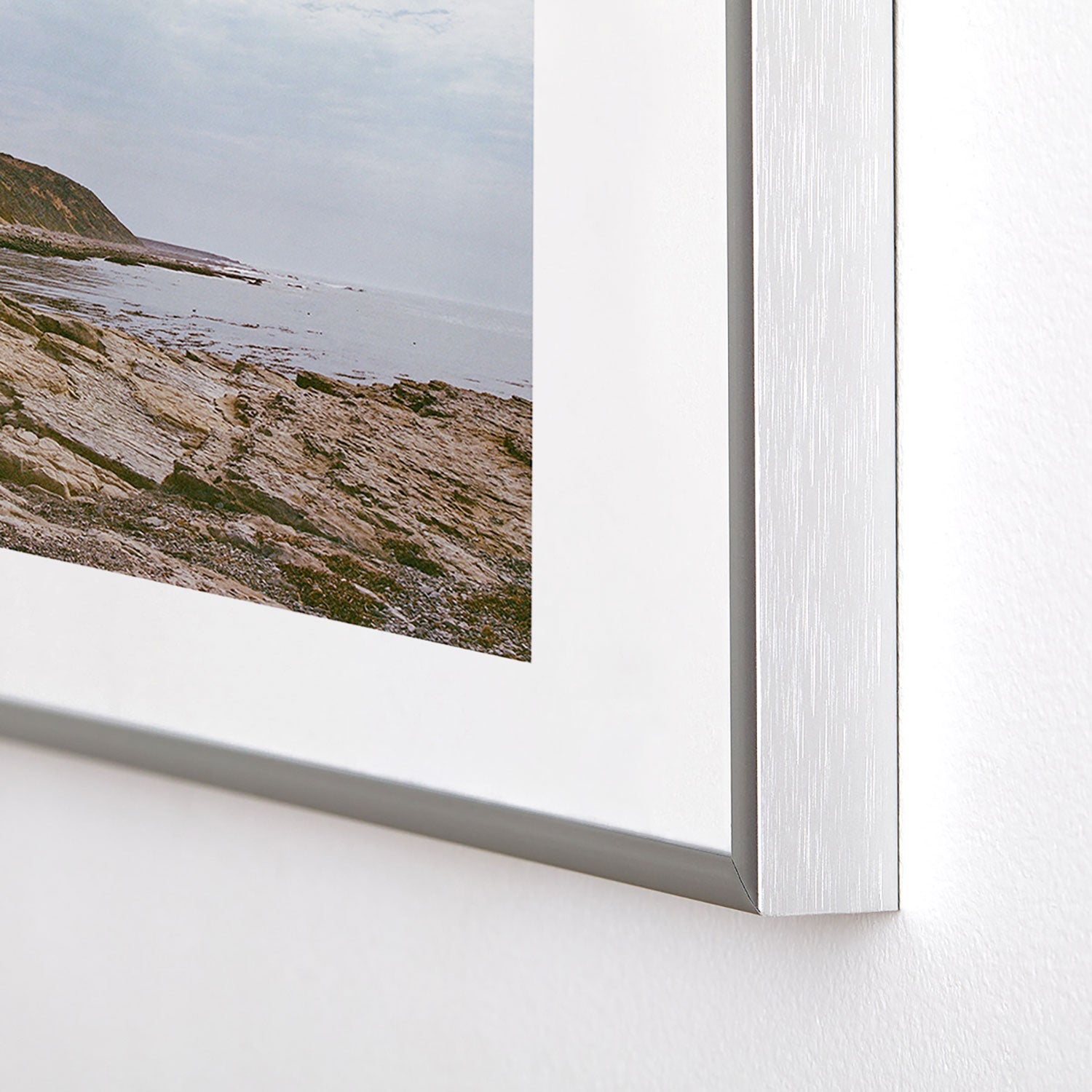 DENY Designs rocky beachside Metal Framed Art Print