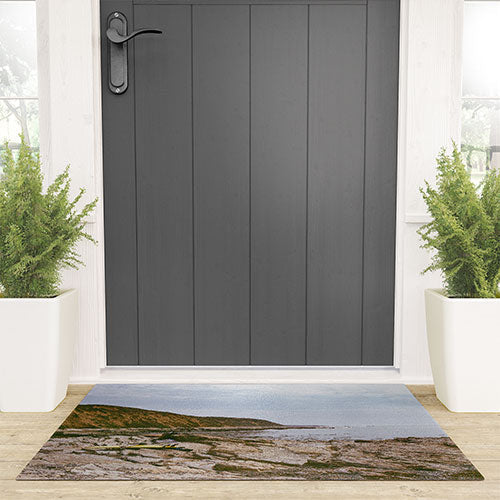 DENY Designs rocky beachside Welcome Mat