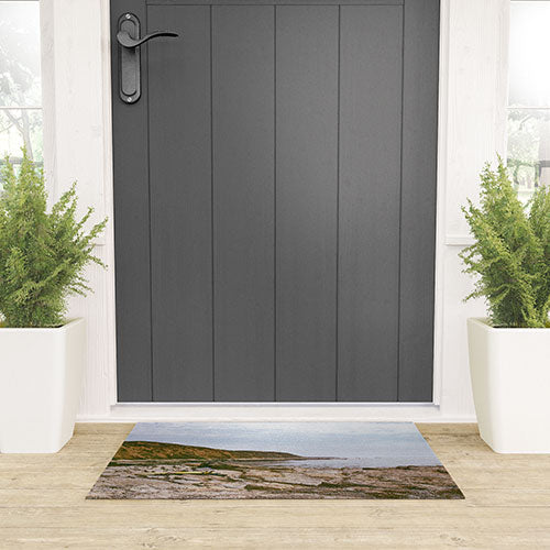 DENY Designs rocky beachside Welcome Mat