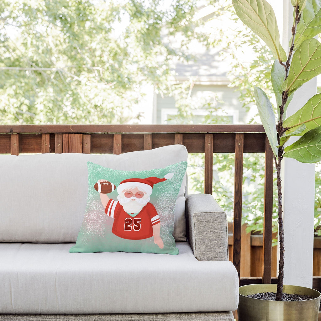 Design by Spark Sporty Football Santa Outdoor Throw Pillow