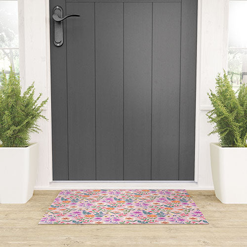 Pimlada Phuapradit Ditsy Floral Pink Welcome Mat